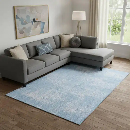 Blue And Ivory Abstract Washable Area Rug With UV Protection Photo 1