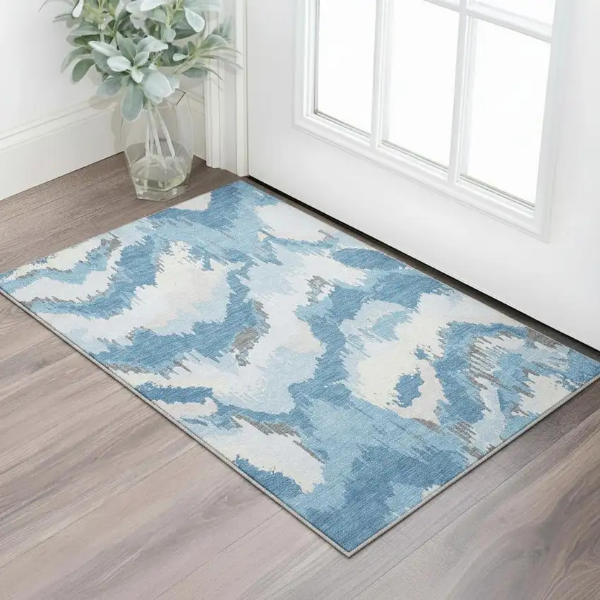 Blue And Ivory Abstract Washable Area Rug With UV Protection Photo 1