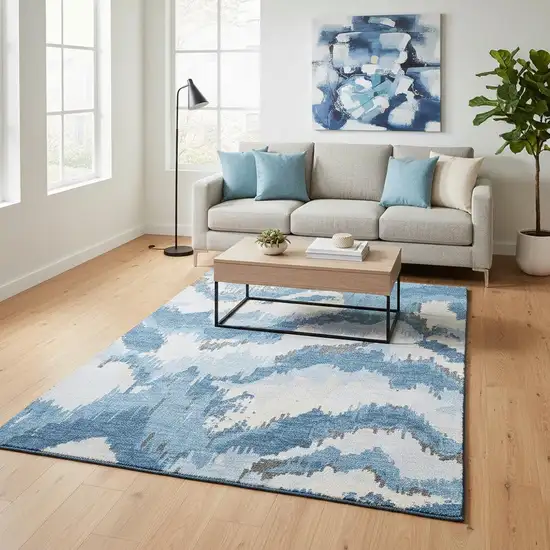 Blue And Ivory Abstract Washable Area Rug With UV Protection Photo 1