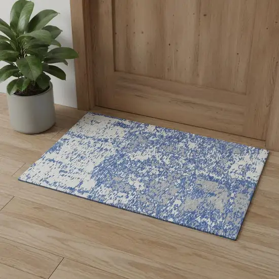 Blue And Ivory Abstract Washable Area Rug With UV Protection Photo 1