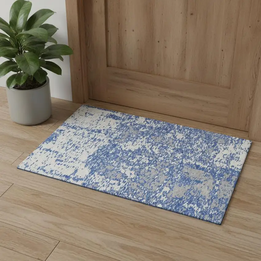 Blue And Ivory Abstract Washable Area Rug With UV Protection Photo 1