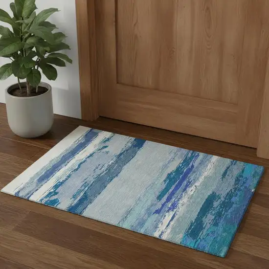 Blue And Ivory Abstract Washable Area Rug With UV Protection Photo 1