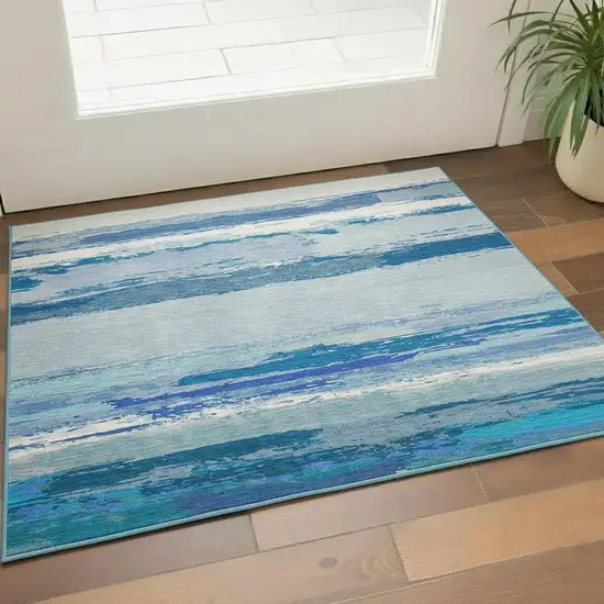 Blue And Ivory Abstract Washable Area Rug With UV Protection Photo 2