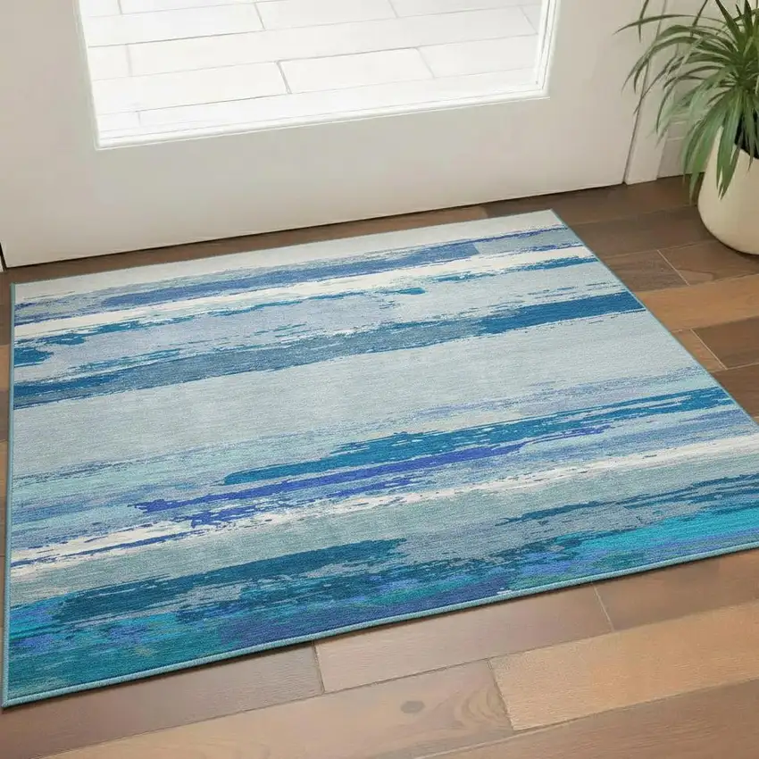 Blue And Ivory Abstract Washable Area Rug With UV Protection Photo 2