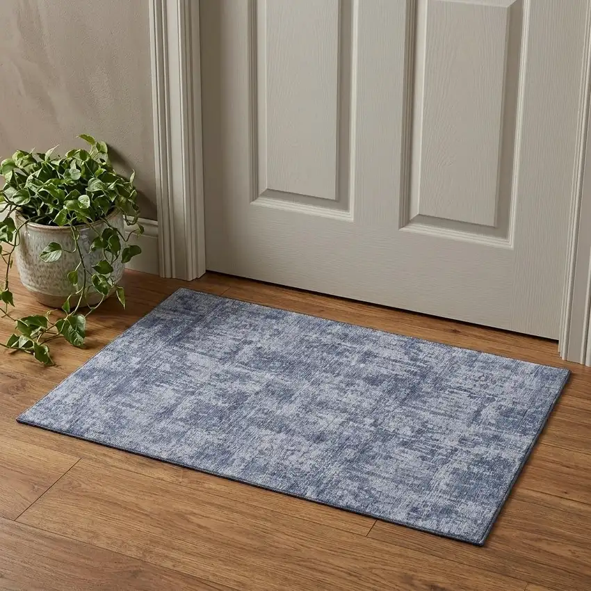 Blue And Ivory Abstract Washable Area Rug With UV Protection Photo 1