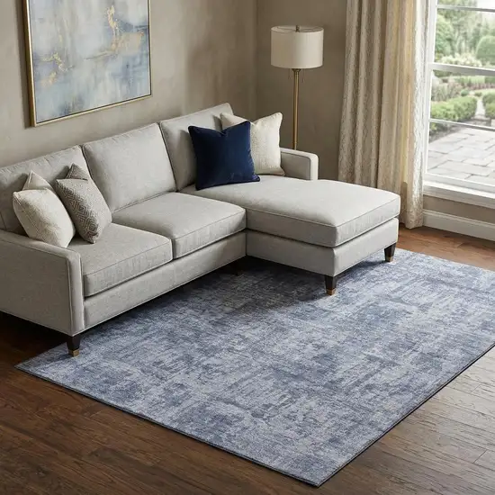 Blue And Ivory Abstract Washable Area Rug With UV Protection Photo 1