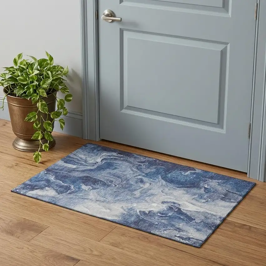 Blue And Ivory Abstract Washable Area Rug With UV Protection Photo 1