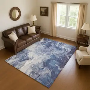 Photo of Blue And Ivory Abstract Washable Area Rug With UV Protection