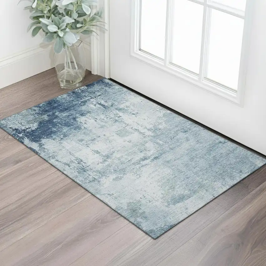 Blue And Ivory Abstract Washable Area Rug With UV Protection Photo 1