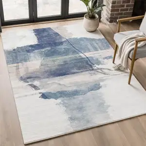 Photo of Blue And Ivory Abstract Washable Area Rug With UV Protection