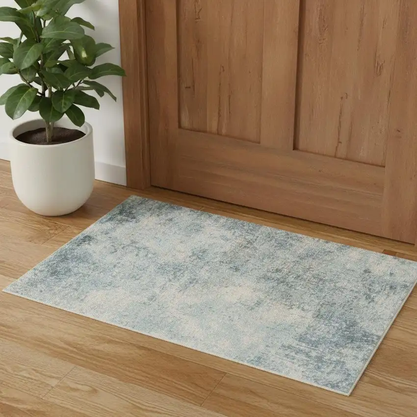 Blue And Ivory Abstract Washable Area Rug Photo 1