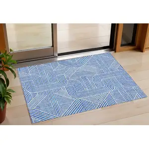Photo of Blue And Ivory Abstract Washable Indoor Outdoor Area Rug