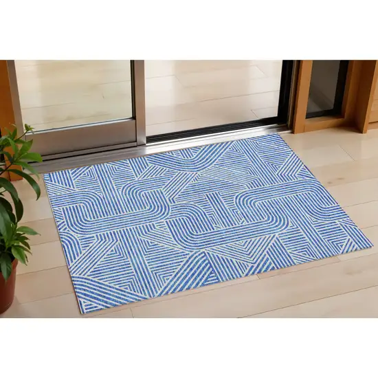 Blue And Ivory Abstract Washable Indoor Outdoor Area Rug Photo 1