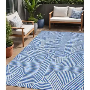 Photo of Blue And Ivory Abstract Washable Indoor Outdoor Area Rug