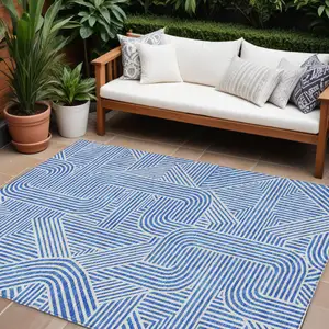 Photo of Blue And Ivory Abstract Washable Indoor Outdoor Area Rug
