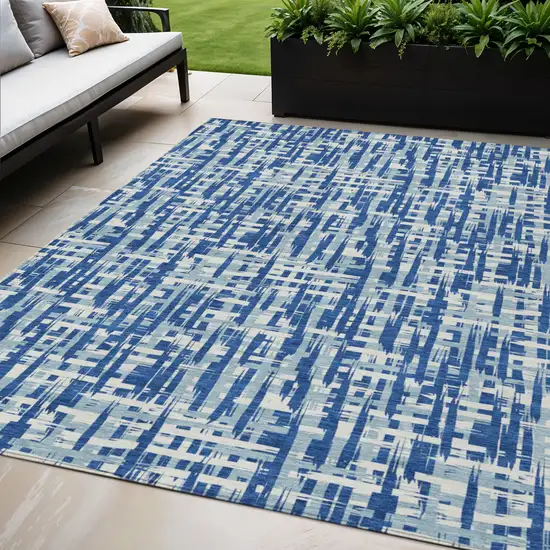 Blue And Ivory Abstract Washable Indoor Outdoor Area Rug Photo 1