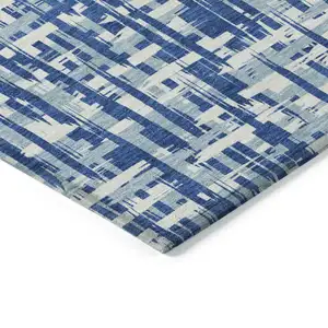 Photo of Blue And Ivory Abstract Washable Indoor Outdoor Area Rug