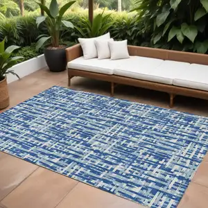 Photo of Blue And Ivory Abstract Washable Indoor Outdoor Area Rug