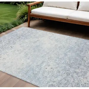 Photo of Blue And Ivory Abstract Washable Indoor Outdoor Area Rug