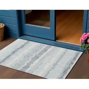 Photo of Blue And Ivory Abstract Washable Indoor Outdoor Area Rug