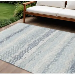 Photo of Blue And Ivory Abstract Washable Indoor Outdoor Area Rug