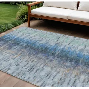 Photo of Blue And Ivory Abstract Washable Indoor Outdoor Area Rug
