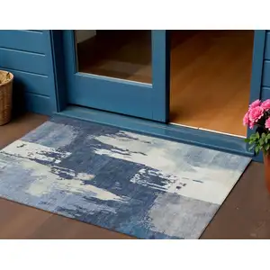 Photo of Blue And Ivory Abstract Washable Indoor Outdoor Area Rug