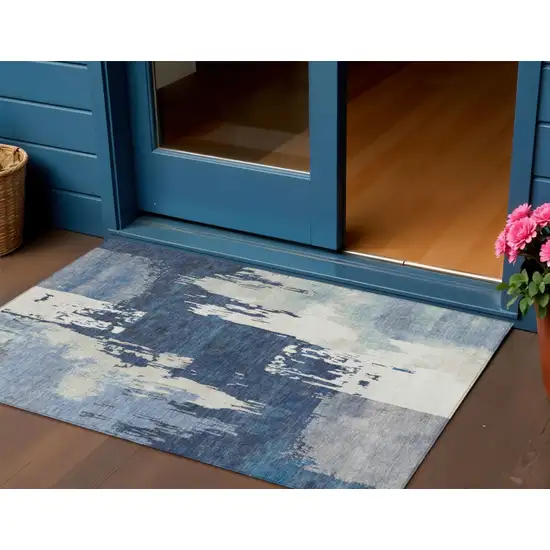 Blue And Ivory Abstract Washable Indoor Outdoor Area Rug Photo 1