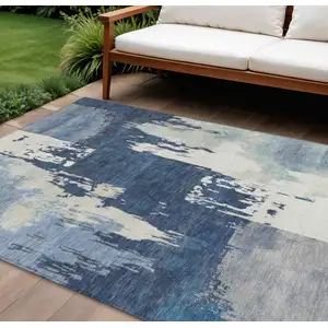 Photo of Blue And Ivory Abstract Washable Indoor Outdoor Area Rug