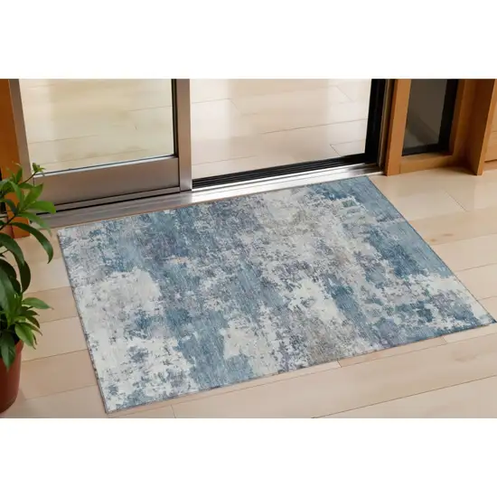 Blue And Ivory Abstract Washable Indoor Outdoor Area Rug Photo 1