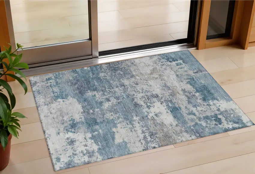 Blue And Ivory Abstract Washable Indoor Outdoor Area Rug Photo 1