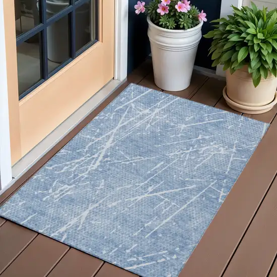 Blue And Ivory Abstract Washable Indoor Outdoor Area Rug Photo 1
