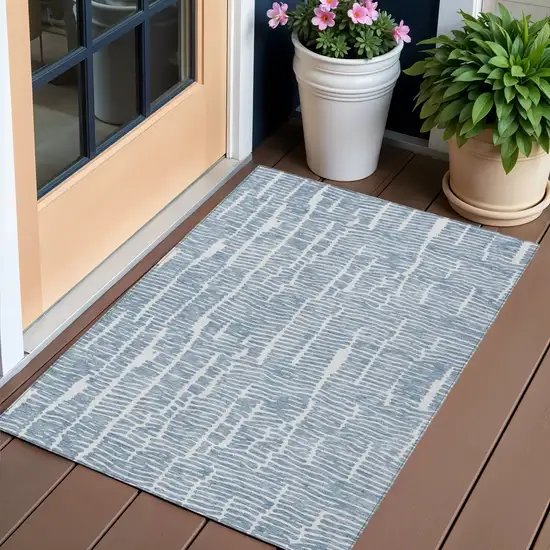Blue And Ivory Abstract Washable Indoor Outdoor Area Rug Photo 1