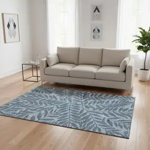 Photo of Blue And Ivory Botanical Leaves Washable Area Rug With UV Protection
