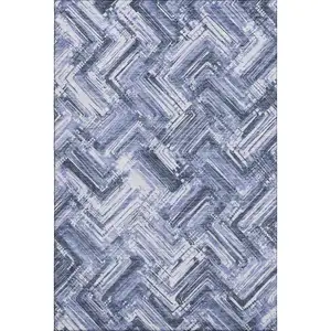 Photo of Blue And Ivory Chevron Washable Area Rug With UV Protection