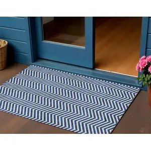 Photo of Blue And Ivory Chevron Washable Indoor Outdoor Area Rug