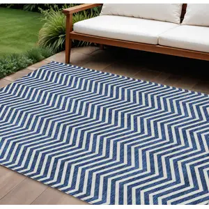 Photo of Blue And Ivory Chevron Washable Indoor Outdoor Area Rug