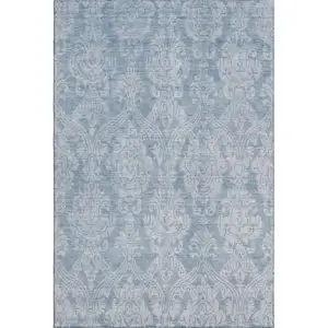 Photo of Blue And Ivory Damask Washable Area Rug With UV Protection