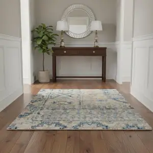 Photo of Blue And Ivory Floral Area Rug With Fringe