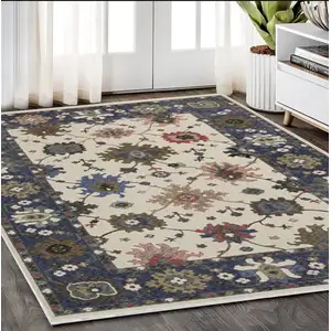 Photo of Blue And Ivory Floral Area Rug With Fringe