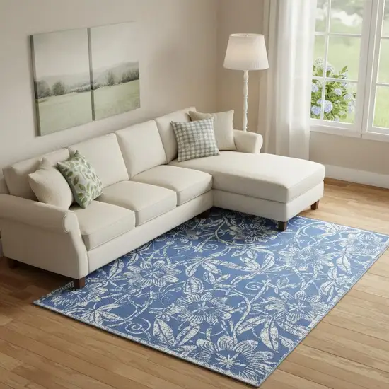Blue And Ivory Floral Distressed Area Rug Photo 1
