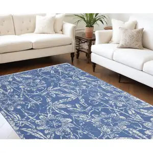 Photo of Blue And Ivory Floral Distressed Area Rug