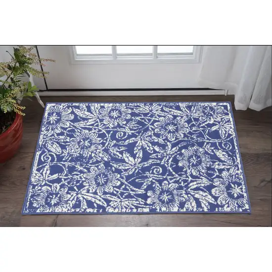 Blue And Ivory Floral Distressed Area Rug Photo 1