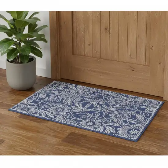 Blue And Ivory Floral Distressed Area Rug Photo 1