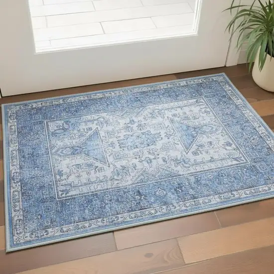 Blue And Ivory Floral Distressed Area Rug Photo 1