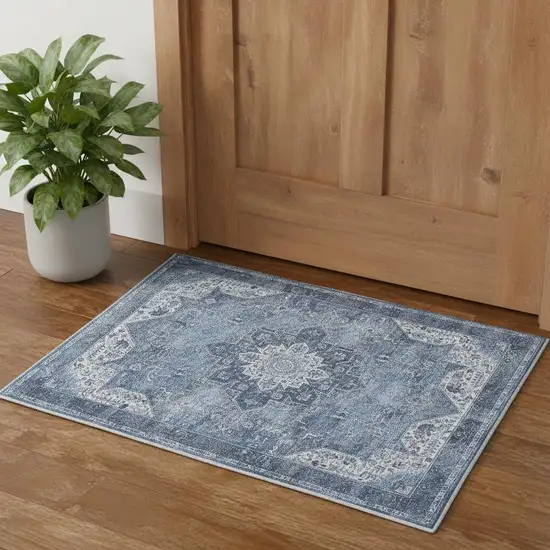 Blue And Ivory Floral Distressed Area Rug Photo 1