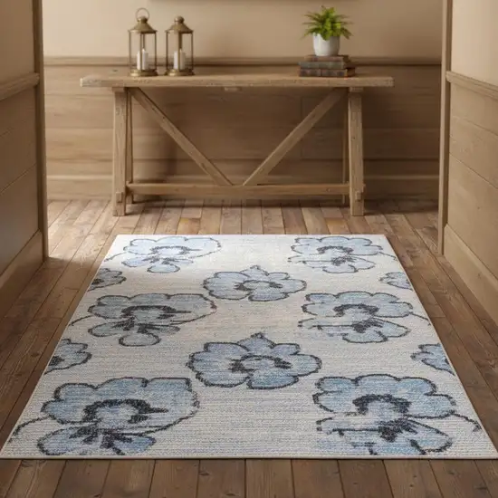 Blue And Ivory Floral Distressed Area Rug Photo 1