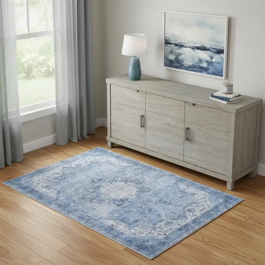 Blue And Ivory Floral Distressed Area Rug Photo 1