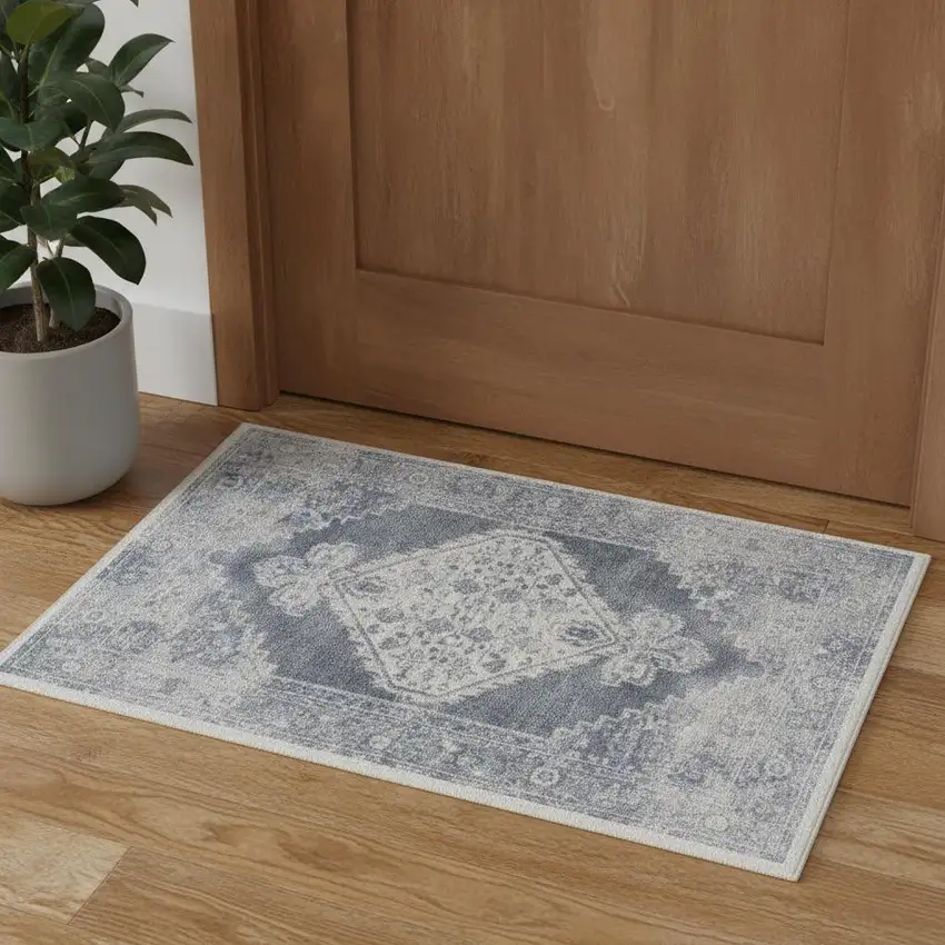 Blue And Ivory Floral Medallion Distressed Washable Area Rug Photo 1