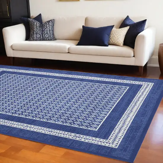 Blue And Ivory Geometric Distressed Area Rug Photo 1